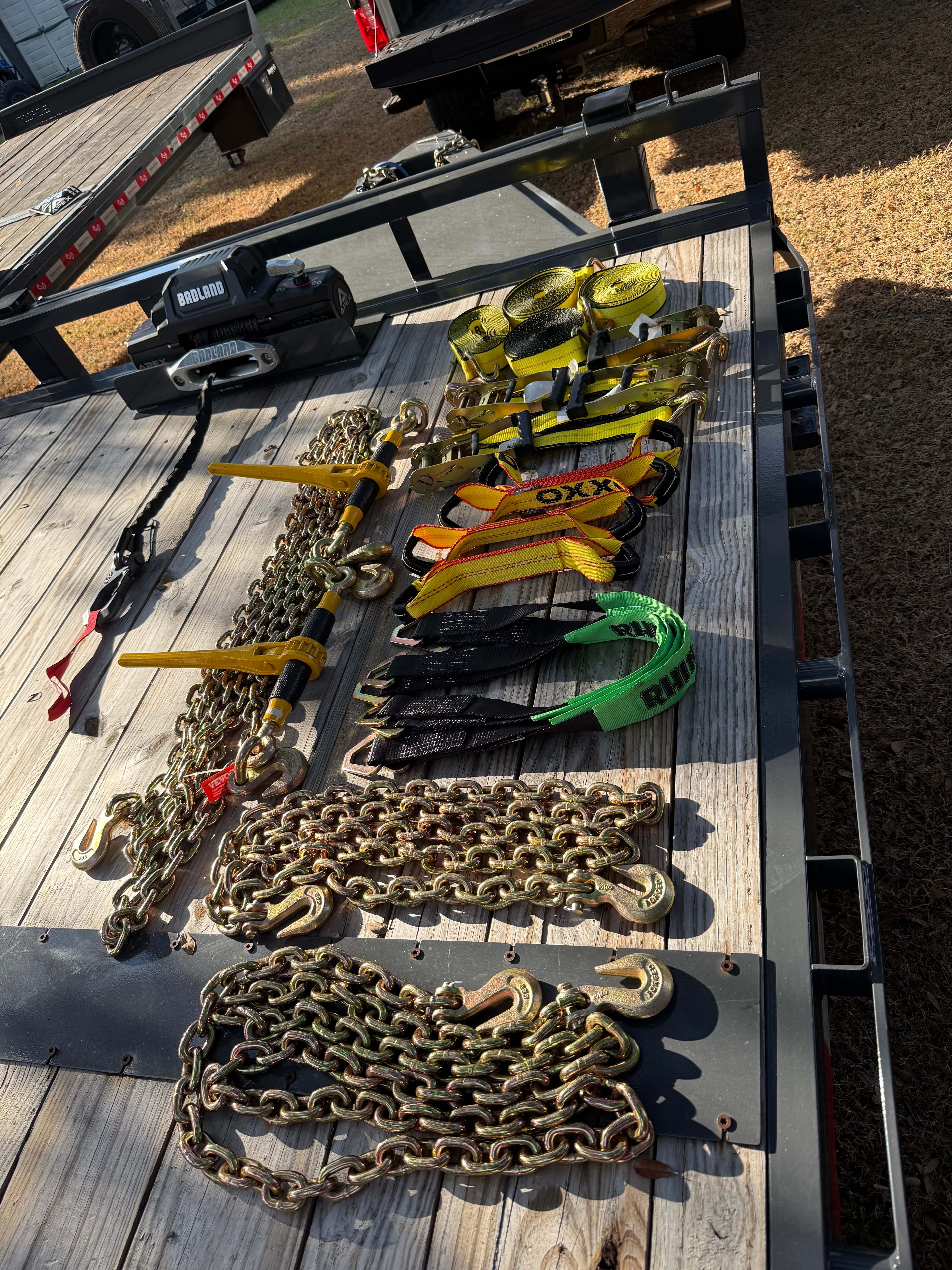 Trailer rental safety equipment overhead view - chains straps and securing gear included
