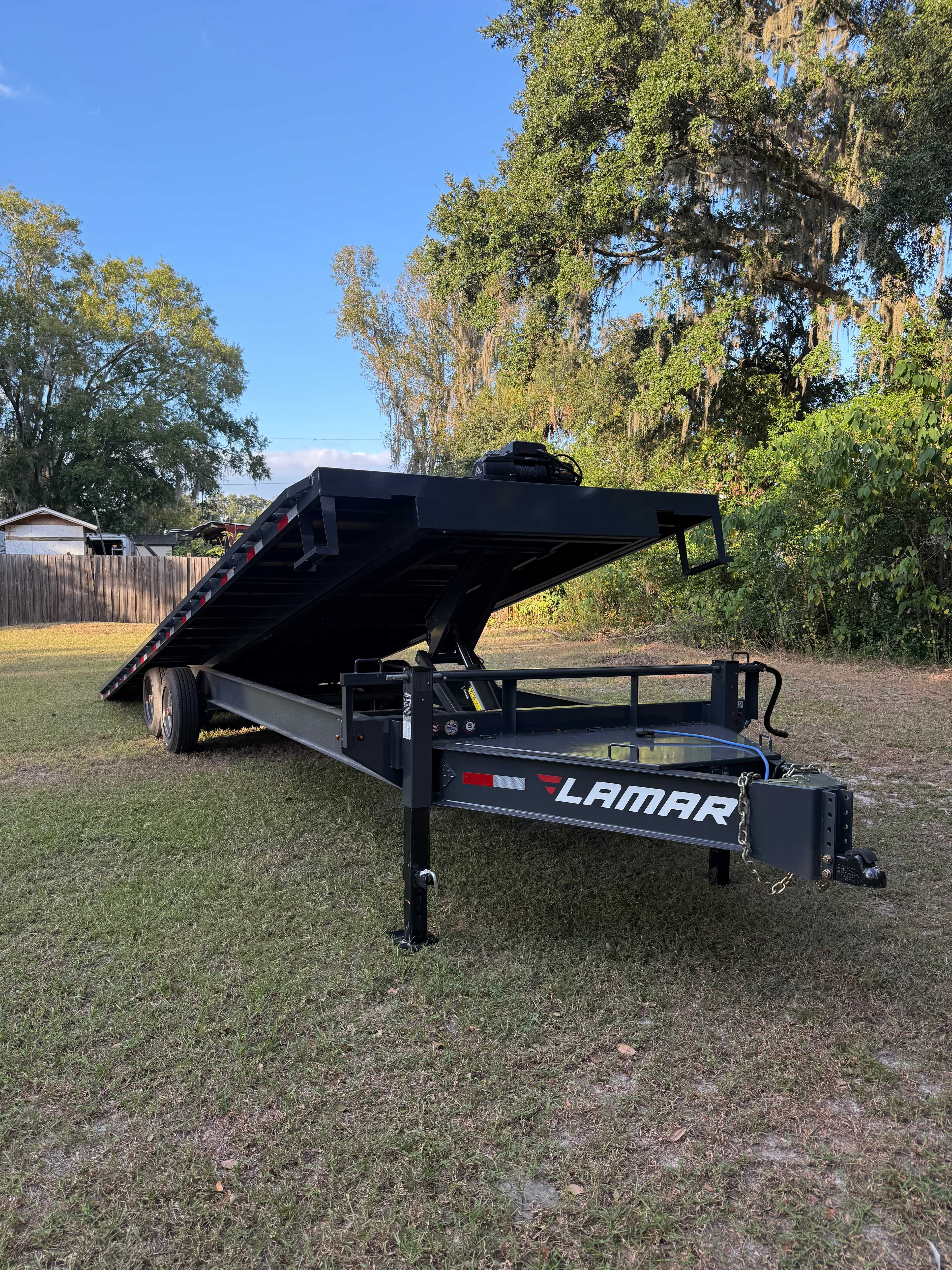 Lamar power tilt equipment trailer rental in Tampa Bay area - 26ft deckover trailer